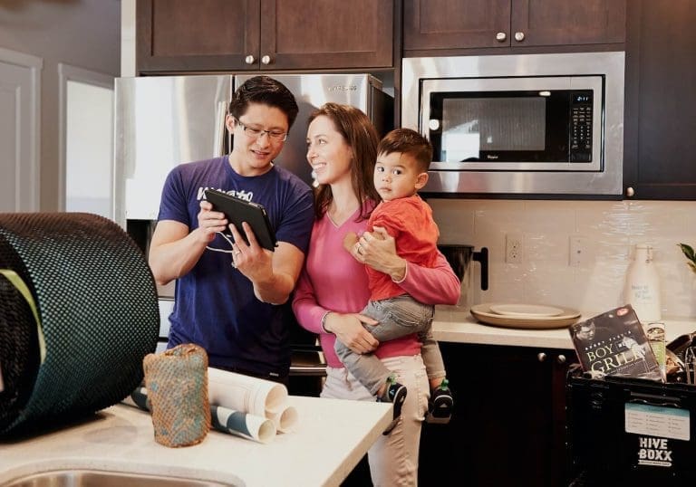 Asian family deciding what appliances to replace